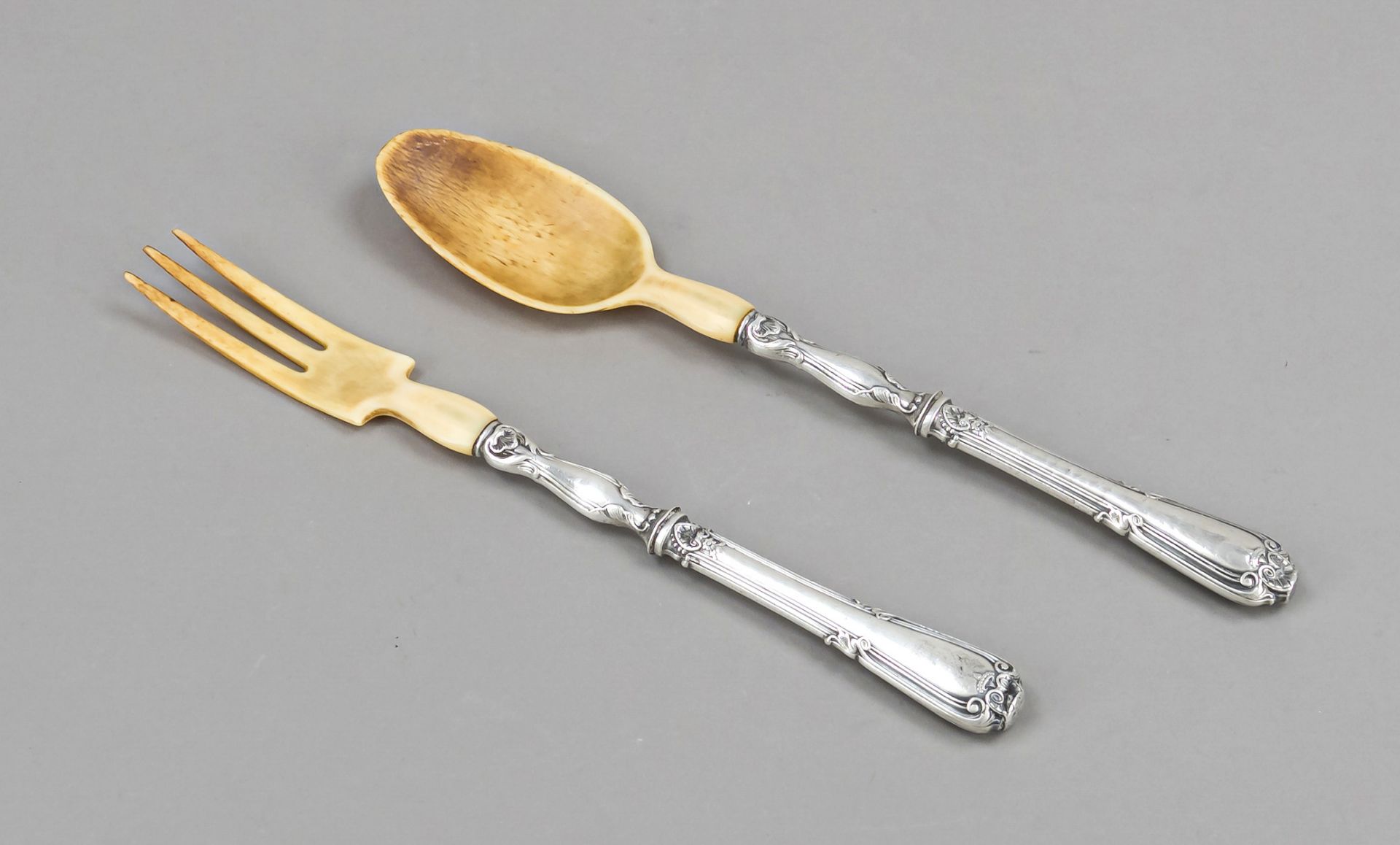 Two-piece salad servers, probably French, silver, unmarked, filled handles with ornamental relief
