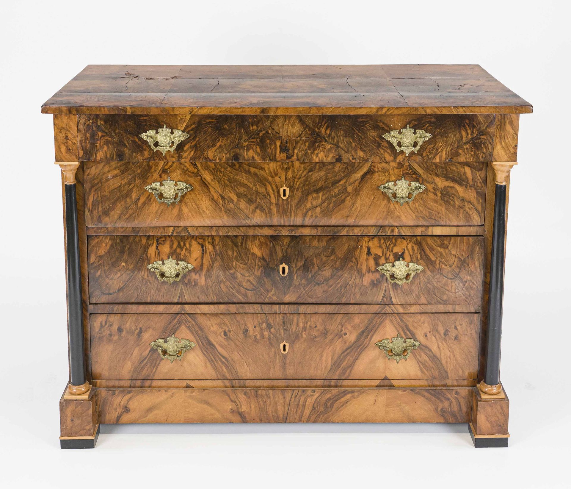 Biedermeier chest of drawers, circa 1820, walnut, four drawers flanked by ebonized full columns,