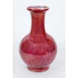 Vase with oxblood glaze, China probably 19th century (Qing). Bellied body with flared lip rim.