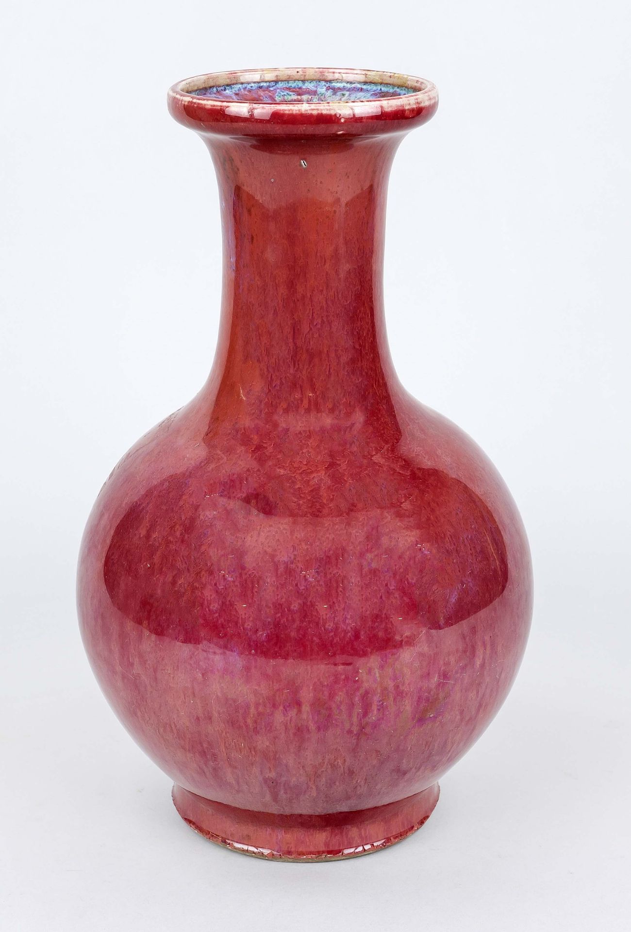 Vase with oxblood glaze, China probably 19th century (Qing). Bellied body with flared lip rim.