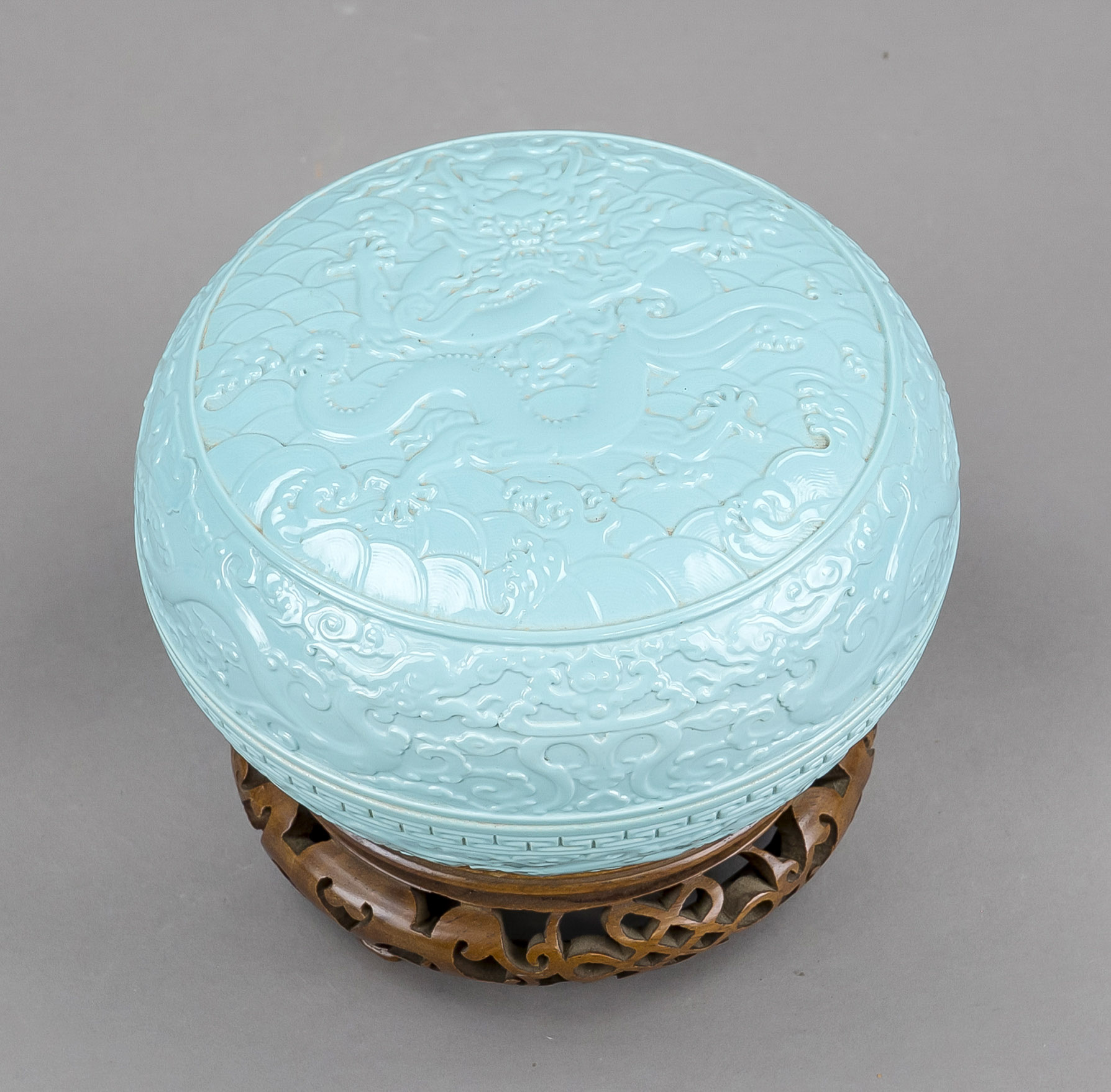 Monochrome lidded box with relief decoration, China, age uncertain. Modelled decoration on all sides