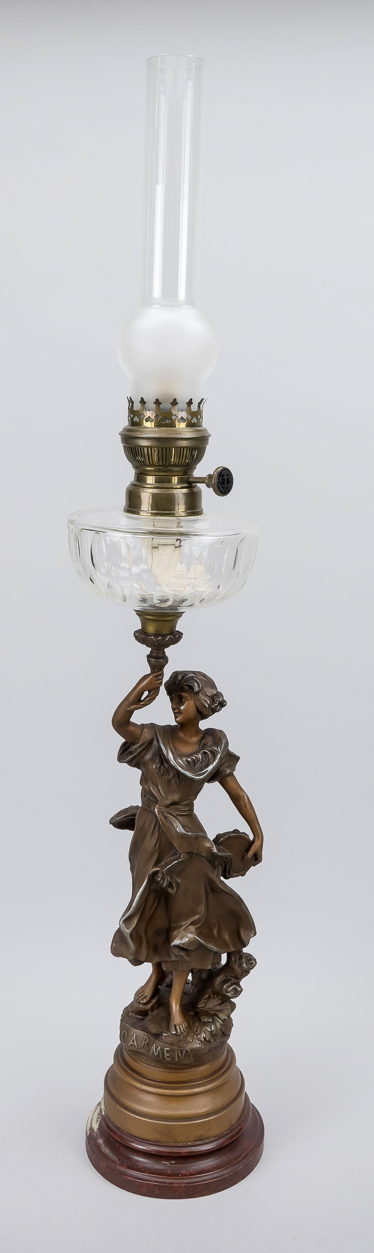 Figural kerosene lamp, late 19th century, inscribed ''Carmen'', signed I. Madrassi. rubbed and