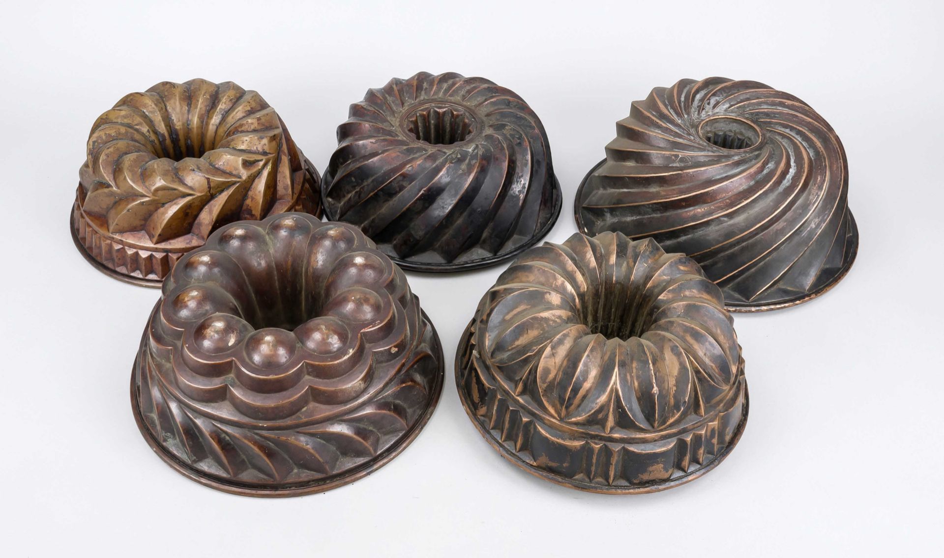 5 historic baking tins, 19th/20th century, Gugelhupf, almost all with ring handles, copper, signs of