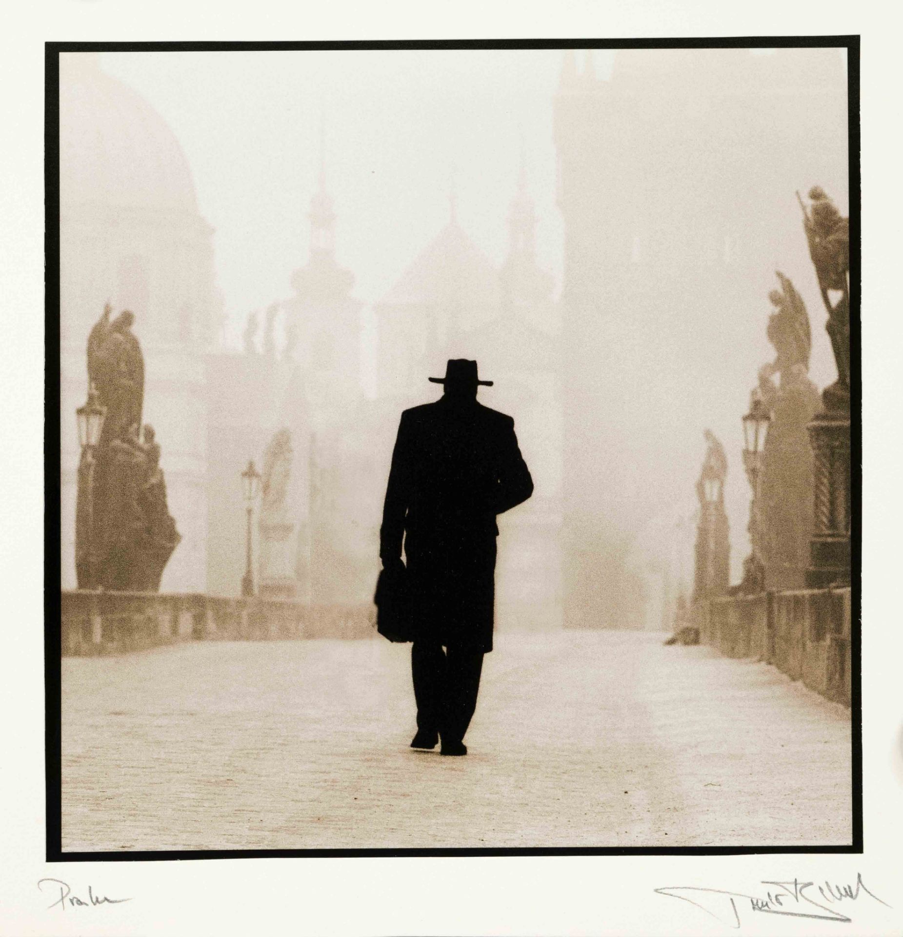 Czech photographer of the 20th century, silhouette of a man on Charles Bridge in Prague,