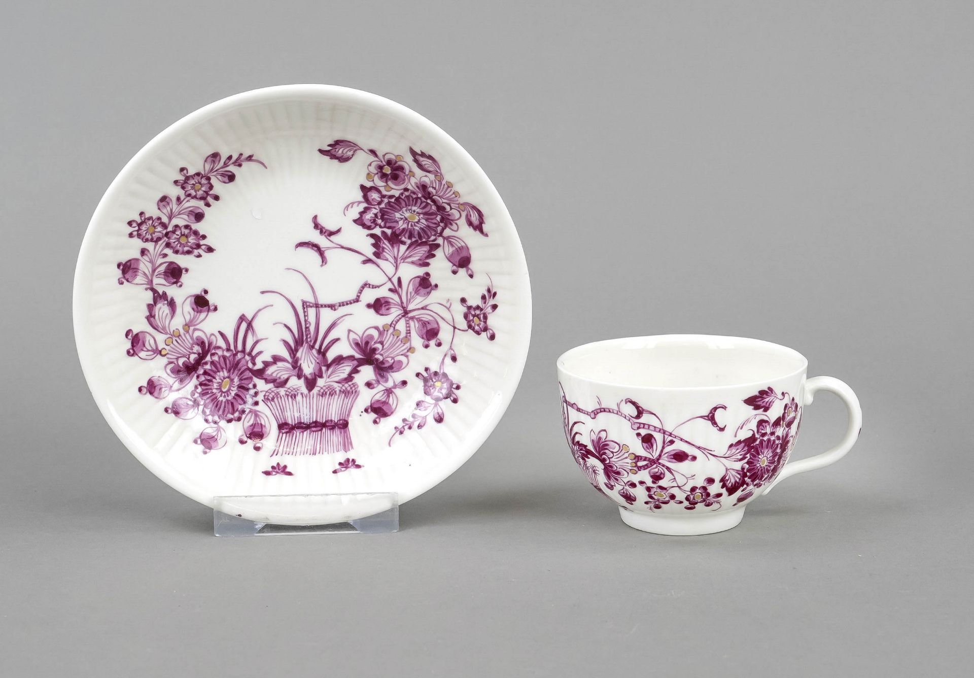 A cup and saucer, Ludwigsburg, 18th century, (?), of hemispherical form, ribbed body with purple
