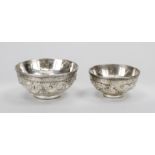 2 Dragon bowls, China 19th/20th century, metal. Revolving relief decoration with dragons between