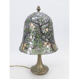 Tiffany-style table lamp, 20th century, heavy, relief metal base with vegetal ornamentation, shade