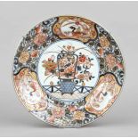 Imari plate, China, c. 1700, the mirror with a basket of flowers, the rim with duck cartouches and
