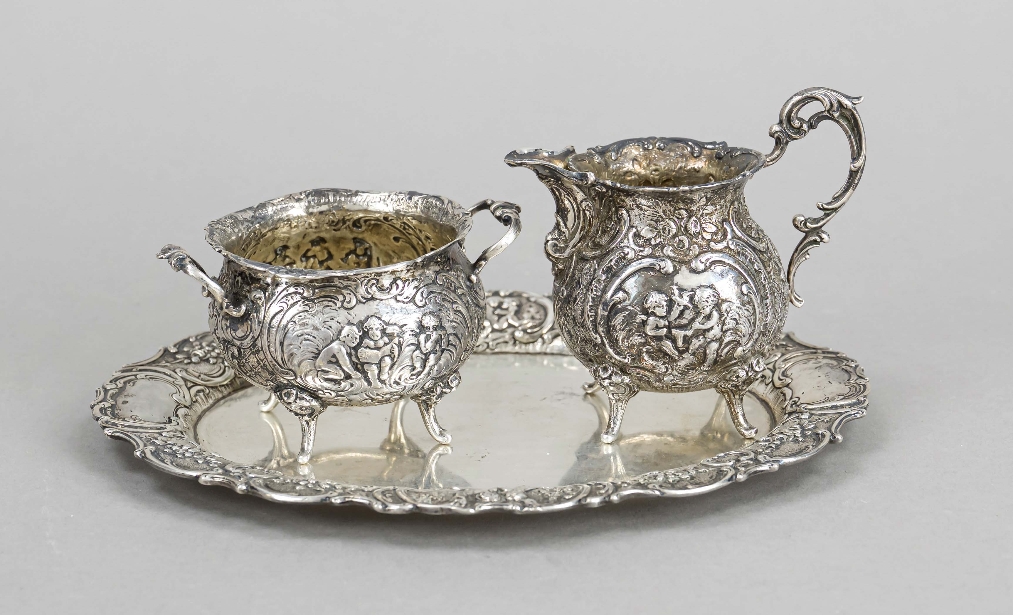 A sugar and cream jug on an oval tray, German, 20th century, probably Hanau, silver 800/000,