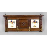 Small wall coat rack, c. 1900, architecturally designed oak plinth with tiles with sprayed