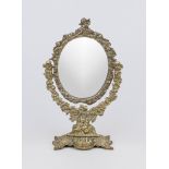 Table mirror, late 19th century, brass/bronze. Oval framed mirror glass (replaced) in ornamented