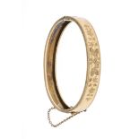 A hinged bangle, circa 1880 RG 585/000 unmarked, tested, the front with fine floral chasing, w. 9.