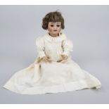 Doll with porcelain head, Germany, early 20th century, movable eyes, dressed in finely embroidered