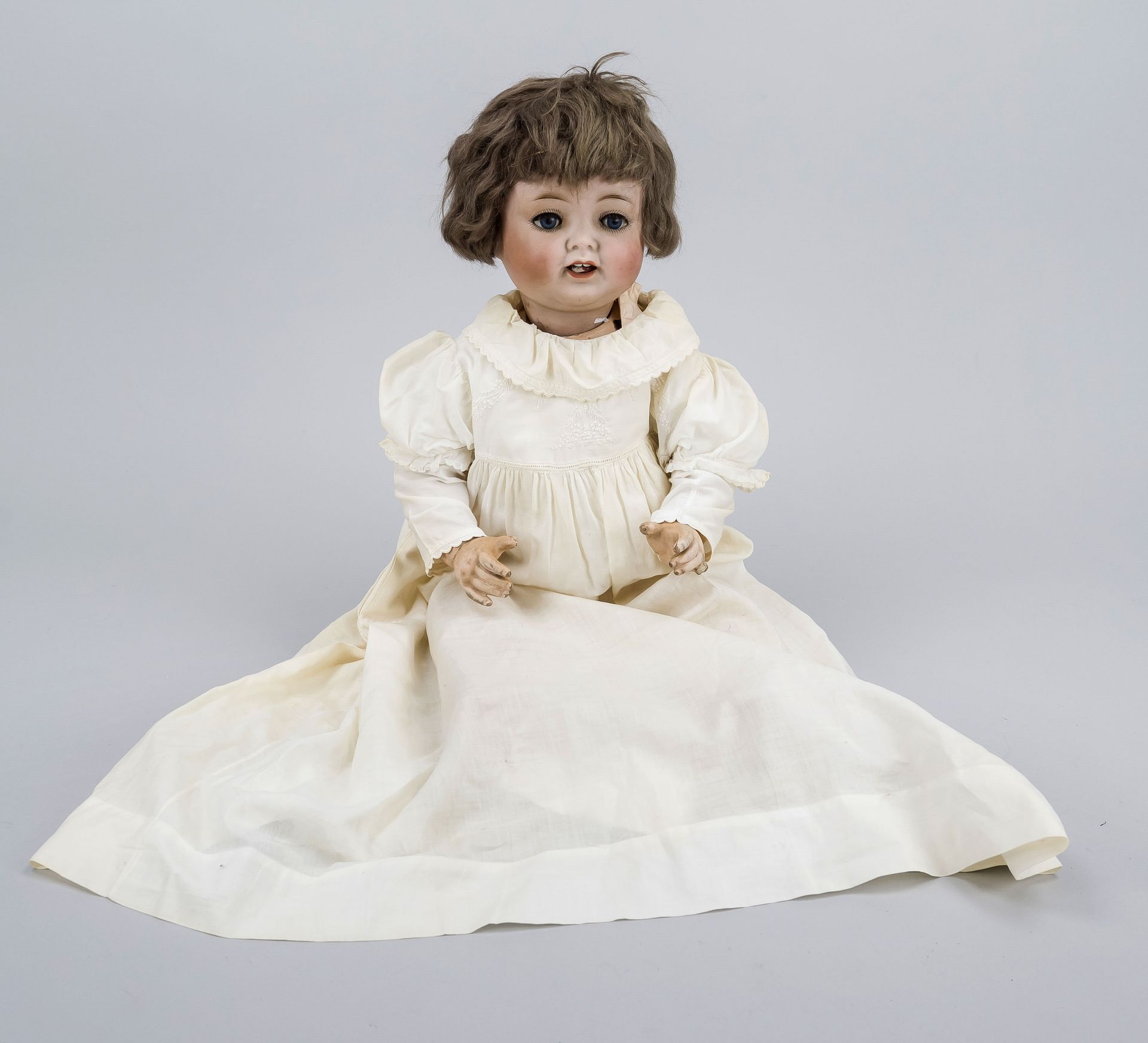 Doll with porcelain head, Germany, early 20th century, movable eyes, dressed in finely embroidered