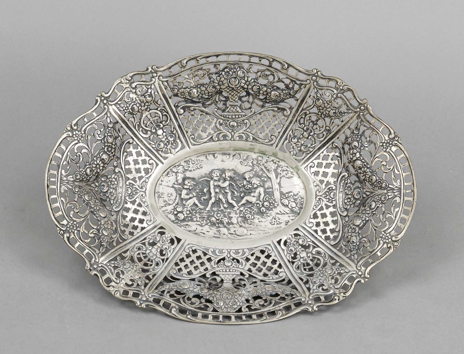 An oval openwork basket, probably German, 20th century, probably Hanau, silver, tested, fitted