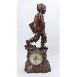 Large carved figure of a boy with writing tablet, mahogany, around 1900, the clock in a carved base,