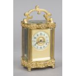 Travel clock, France, circa 1890, fire-gilt brass, curved case, fire-gilt applications, top