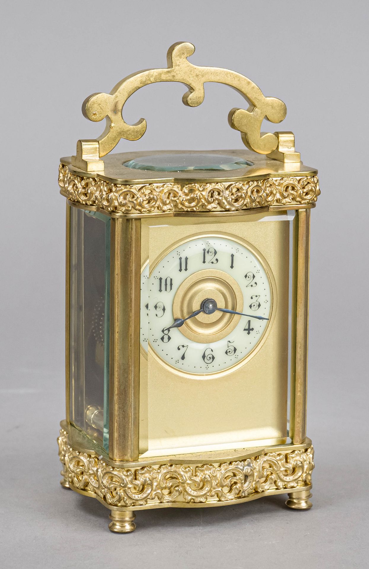 Travel clock, France, circa 1890, fire-gilt brass, curved case, fire-gilt applications, top