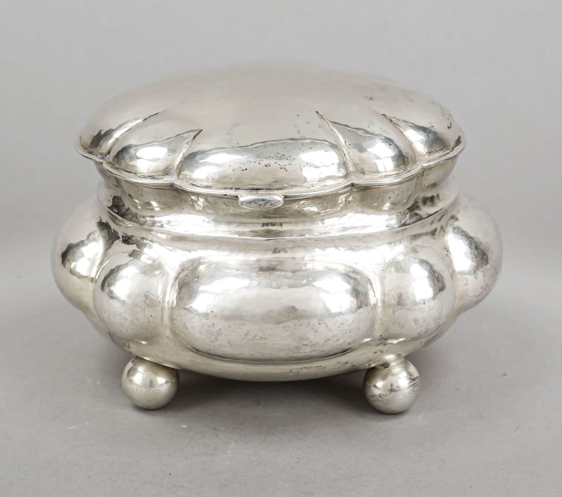 Oval lidded box, German, 20th century, silver 800/000, gilt interior, on 4 ball feet, humped form,