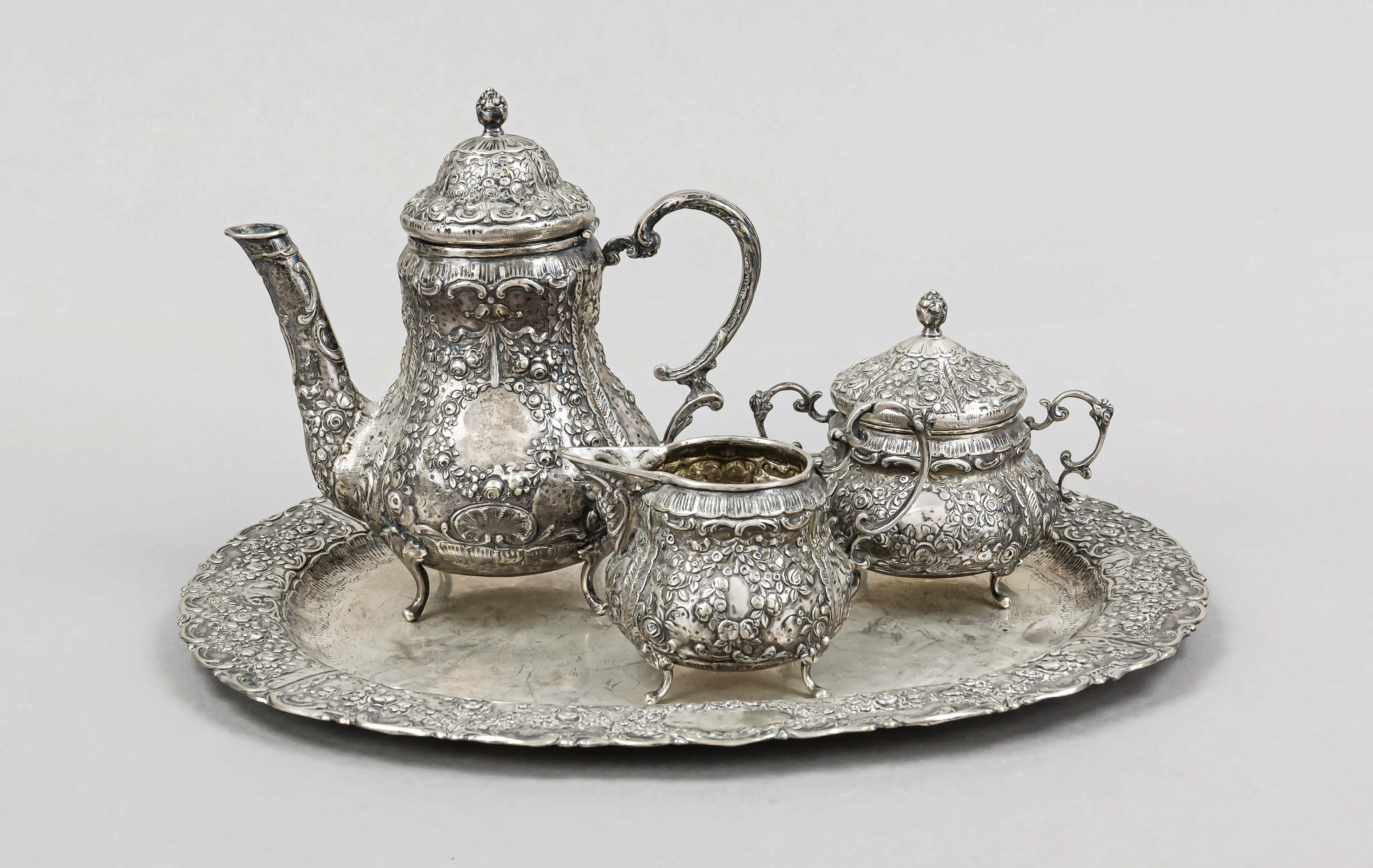 A three-piece mocha pot on an oval tray, German, 20th century, silver 800/000, partly gilt interior,