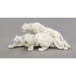 Large lion group, 20th century, masterly sculpture of two cats of prey in a creeping pose, white,