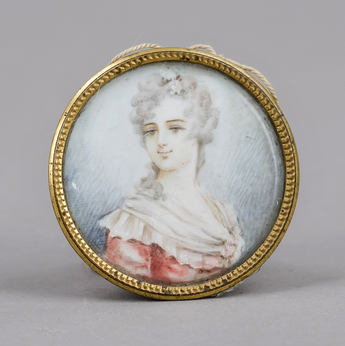 Small round miniature, 19th century, polychrome tempera painting on bone plate. Young woman in a
