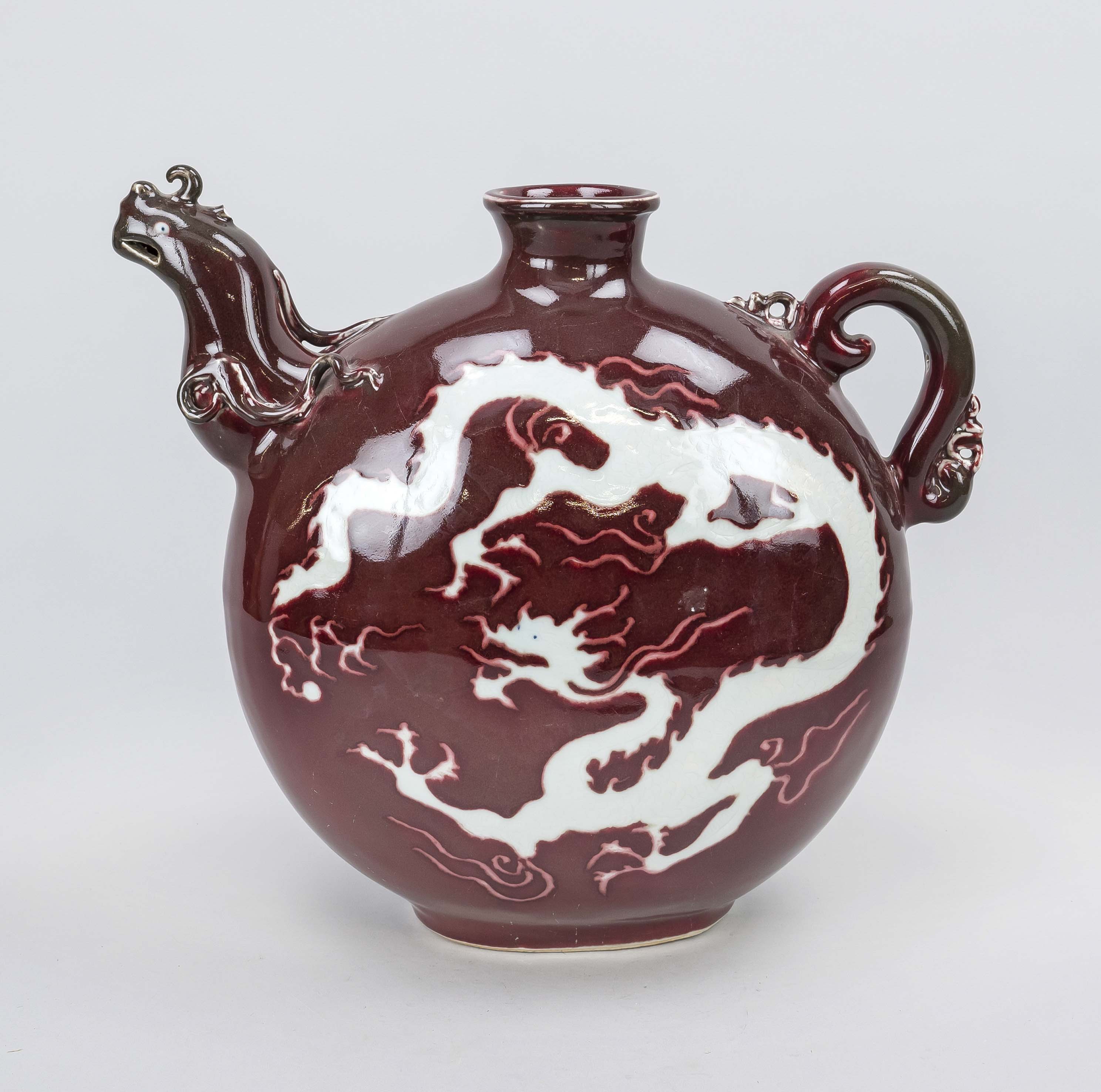 Copper-red ground jug with dragon decoration, China, 20th century Dragon as negative form with