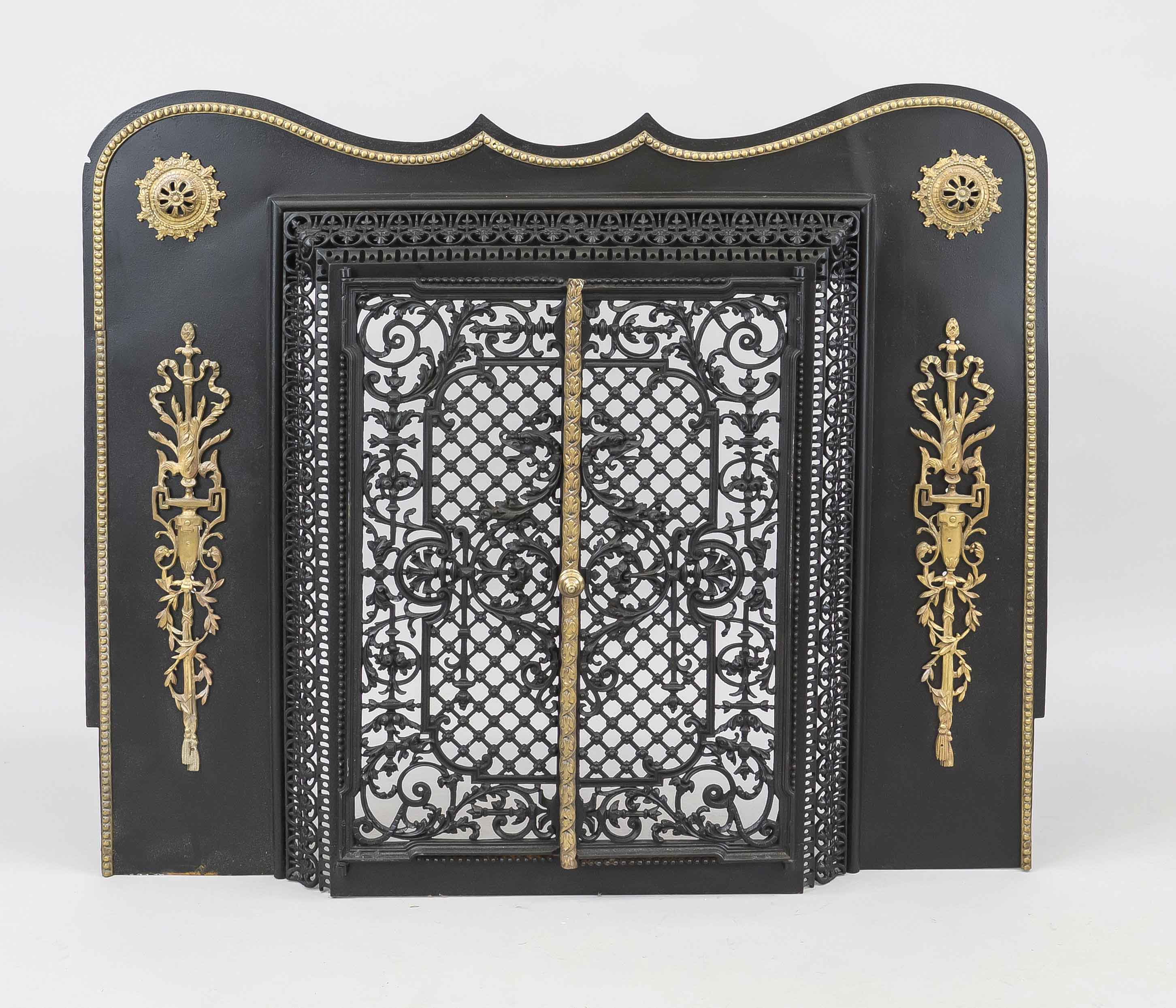 Fireplace porch, late 19th century, painted iron black, brass. Curved panel with decorative