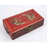 Dragon casket, China, 20th century, wood with red lacquer, partially decorated in gold. Brass