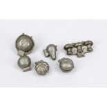 6 chocolate molds, around 1900, pewter. Each with hinged joint. Various molds, different makers.