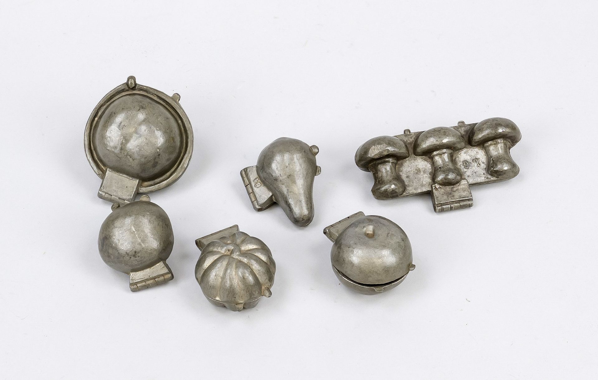 6 chocolate molds, around 1900, pewter. Each with hinged joint. Various molds, different makers.