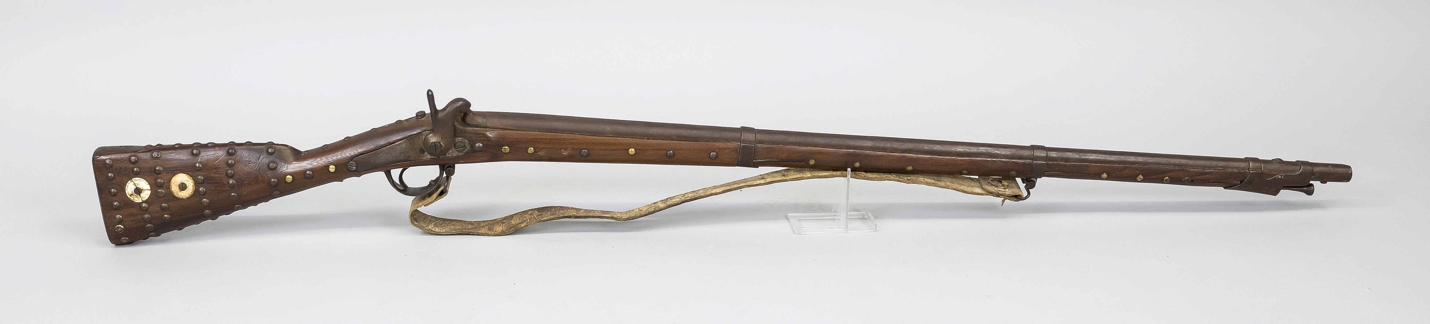 Percussion rifle, 19th century, stock and butt studded with numerous decorative nails, barrel with