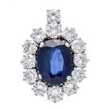 Sapphire and brilliant-cut diamond clip pendant WG 750/000 with a fine oval faceted sapphire 3.02 ct