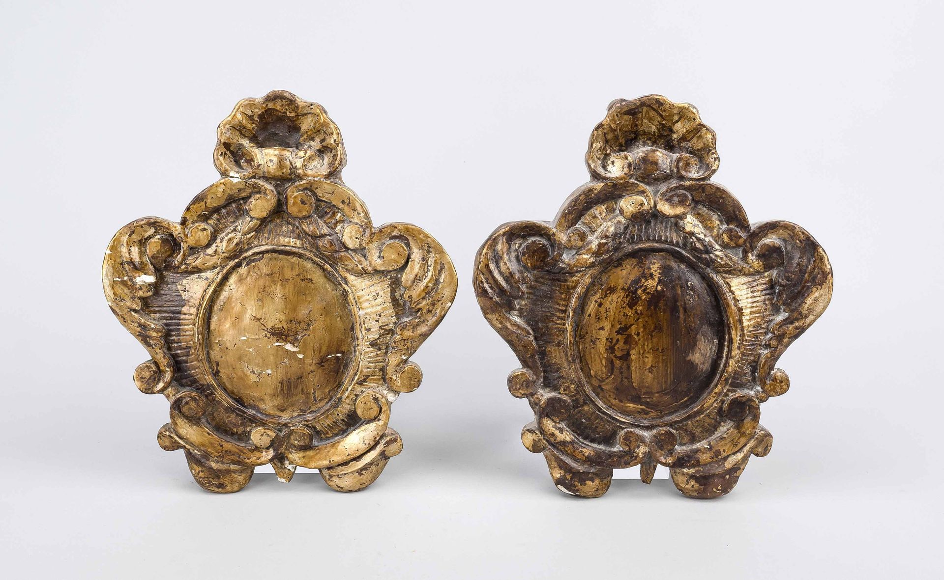 Pair of canon panels, probably 19th century, carved and gilded wood, h. 27 cm