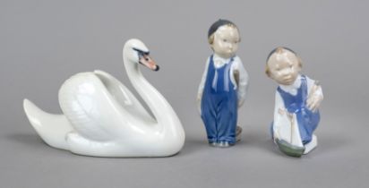 Three figures, Royal Copenhagen, Denmark, 20th century, boy with sailing boat, designed by Aage