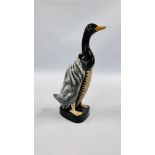 A MID CENTURY BAKELITE CLOTHES BRUSH IN THE FORM OF A STANDING DUCK. H 27CM.