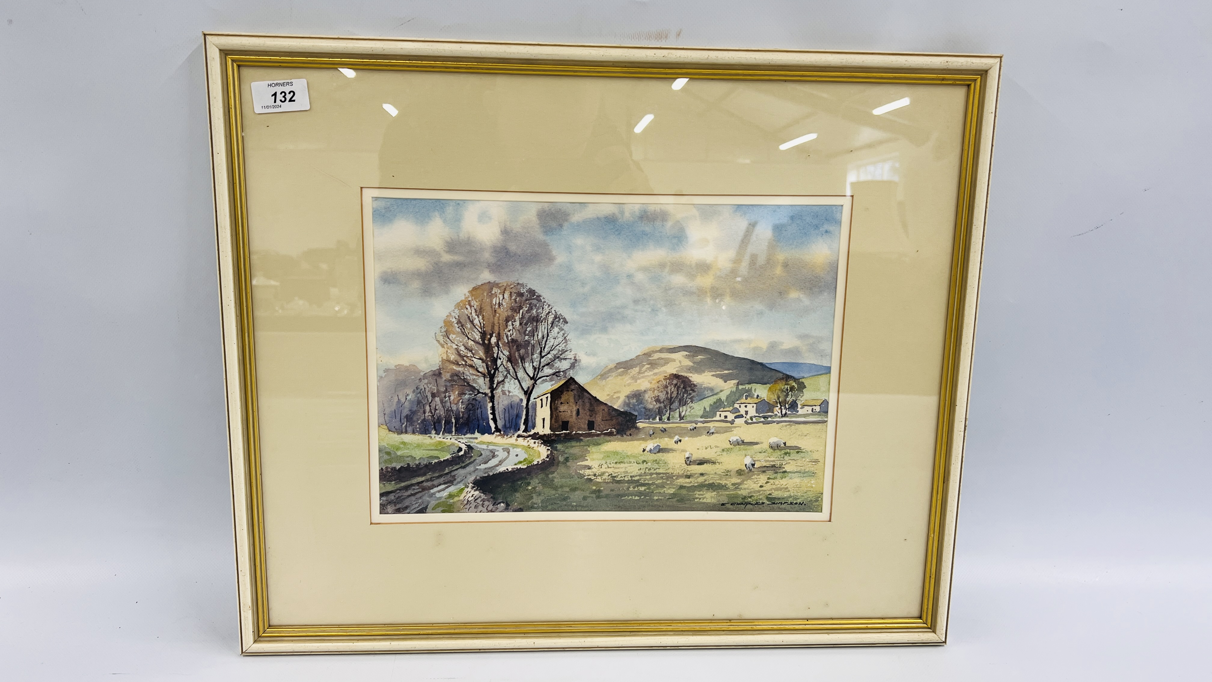 A FRAMED AND MOUNTED WATERCOLOUR "BARN IN UPPER WENSLEYDALE 1993" BEARING SIGNATURE E.