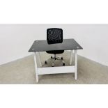 A MODERN DESIGNER HOME DESK WITH BLACK GLASS TOP ALONG WITH A MODERN ADJUSTABLE OFFICE CHAIR.