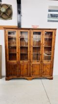 DUCAL HONEY PINE TRIPLE DOOR GLAZED TOP DISPLAY CABINET WITH CUPBOARD BASE.