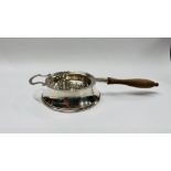 AN ANTIQUE SILVER STRAINER AND STAND, BIRMINGHAM ASSAY MAKER J.B. CHATTERLEY & SONS. L 20.