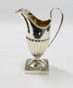 AN ANTIQUE SILVER HELMET SHAPED CREAM JUG, BIRMINGHAM ASSAY 1904 MAKER C.H. H 12CM.