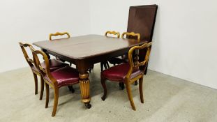 A MAHOGANY VICTORIAN STYLE EXTENDING DINING TABLE WITH WIND OUT ACTION AND THREE EXTENSION LEAVES