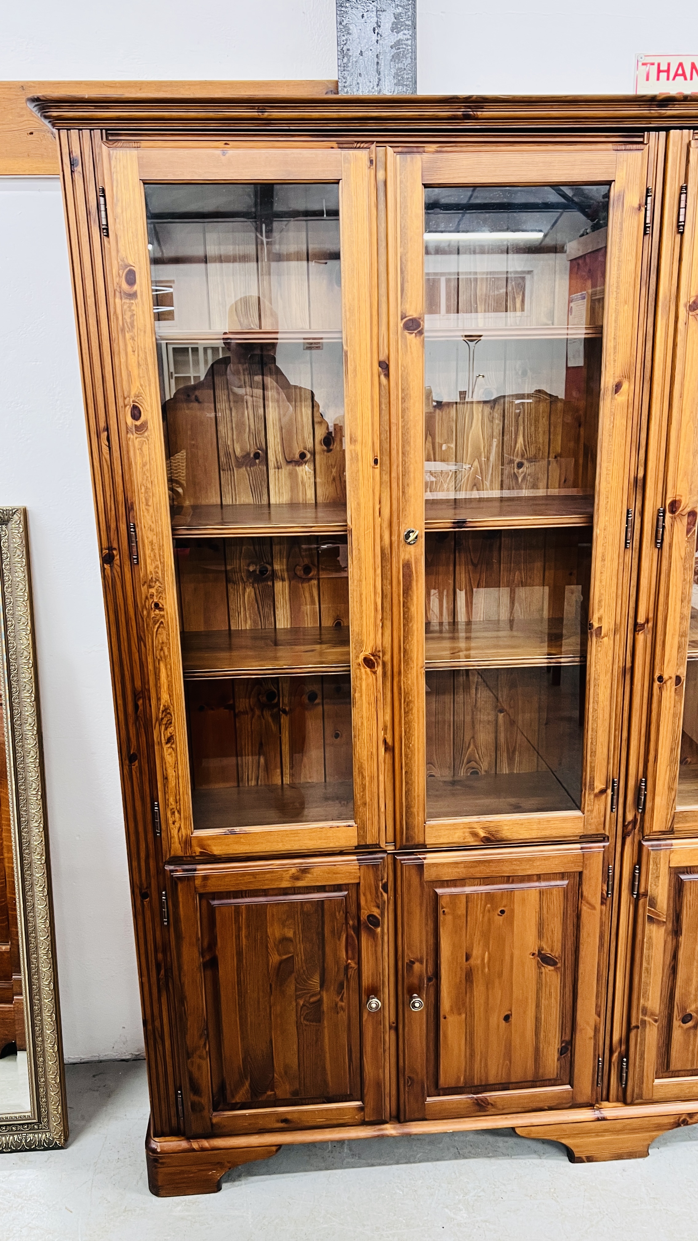 DUCAL HONEY PINE TRIPLE DOOR GLAZED TOP DISPLAY CABINET WITH CUPBOARD BASE. - Image 3 of 6