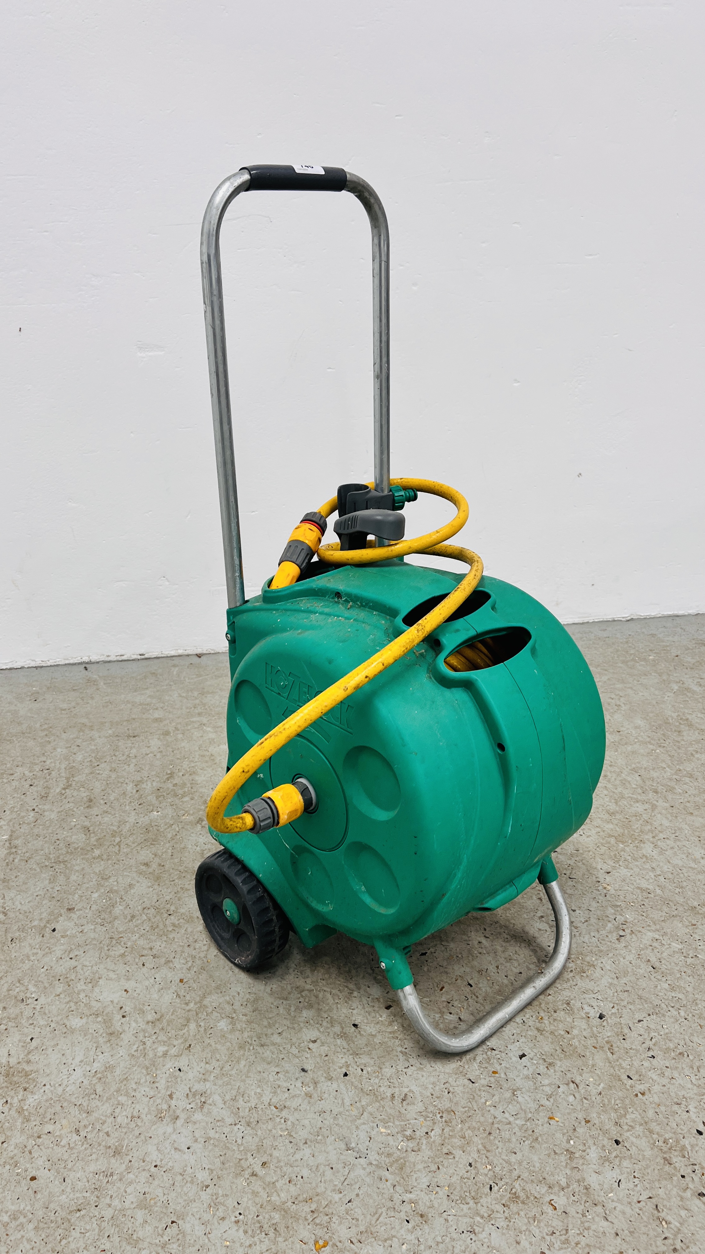 A HOZELOCK GARDEN HOSE ON REEL.