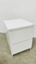 A TWO DRAWER WHITE FINISH IKEA BEDSIDE CHEST.