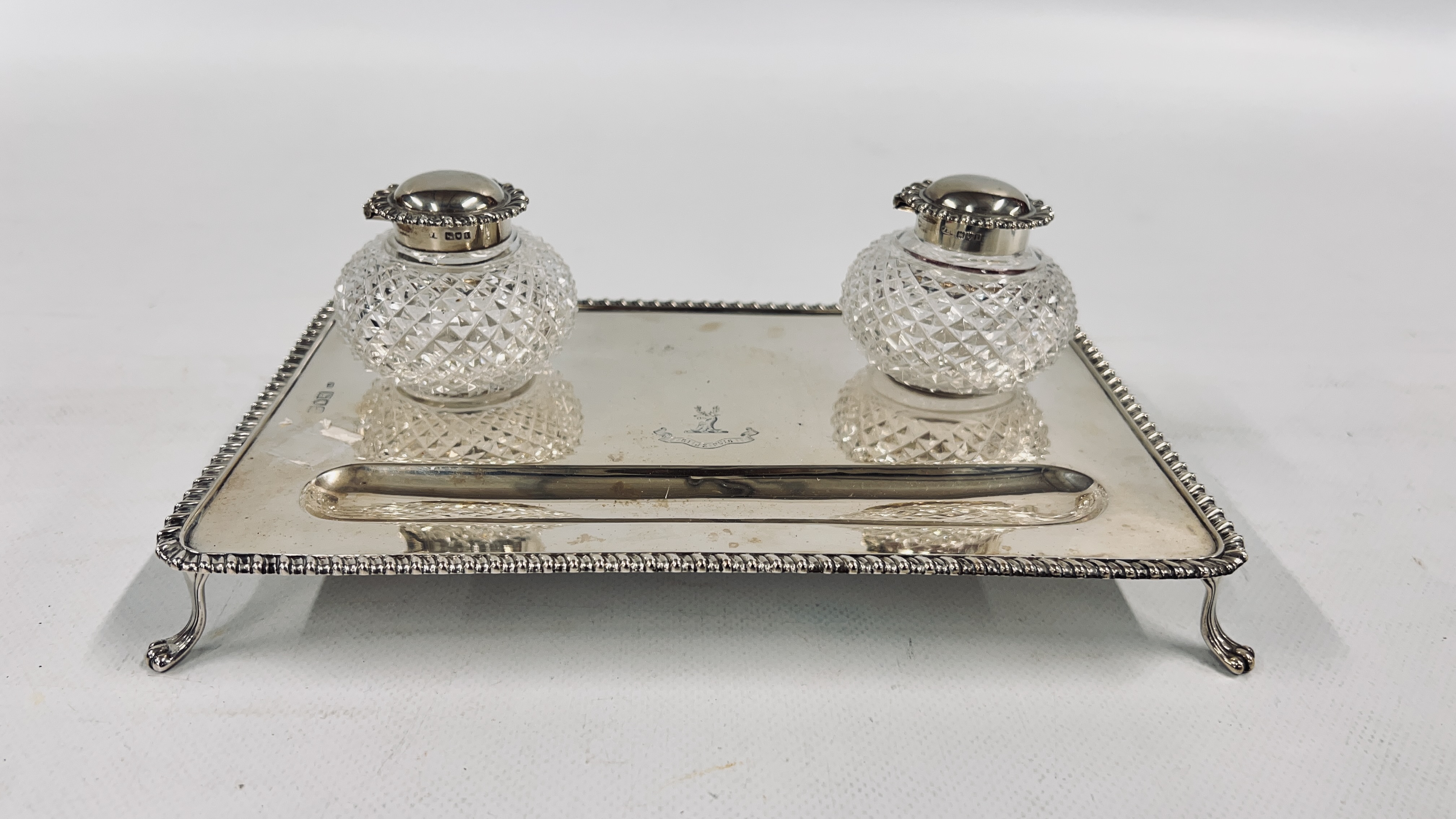 AN ANTQUE SILVER DOUBLE INK STAND RETAINING THE ORIGINAL HOBNAIL GLASS SILVER TOP INKWELLS,