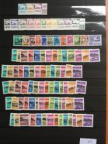 STAMPS: STOCKBOOK WITH DUPLICATED MINT GUERNSEY AND JERSEY, PRE-DECIMAL BLOCKS, POSTAGE DUES ETC.