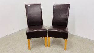A PAIR OF DARK TAN FAUX LEATHER DINING CHAIRS.