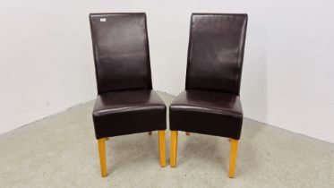 A PAIR OF DARK TAN FAUX LEATHER DINING CHAIRS.