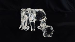 TWO SWAROVSKI CRYSTAL ELEPHANT ORNAMENTS H 8CM X L 11CM & H 4.5CM X L 6CM.